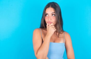 concerned young woman considering breast augmentation